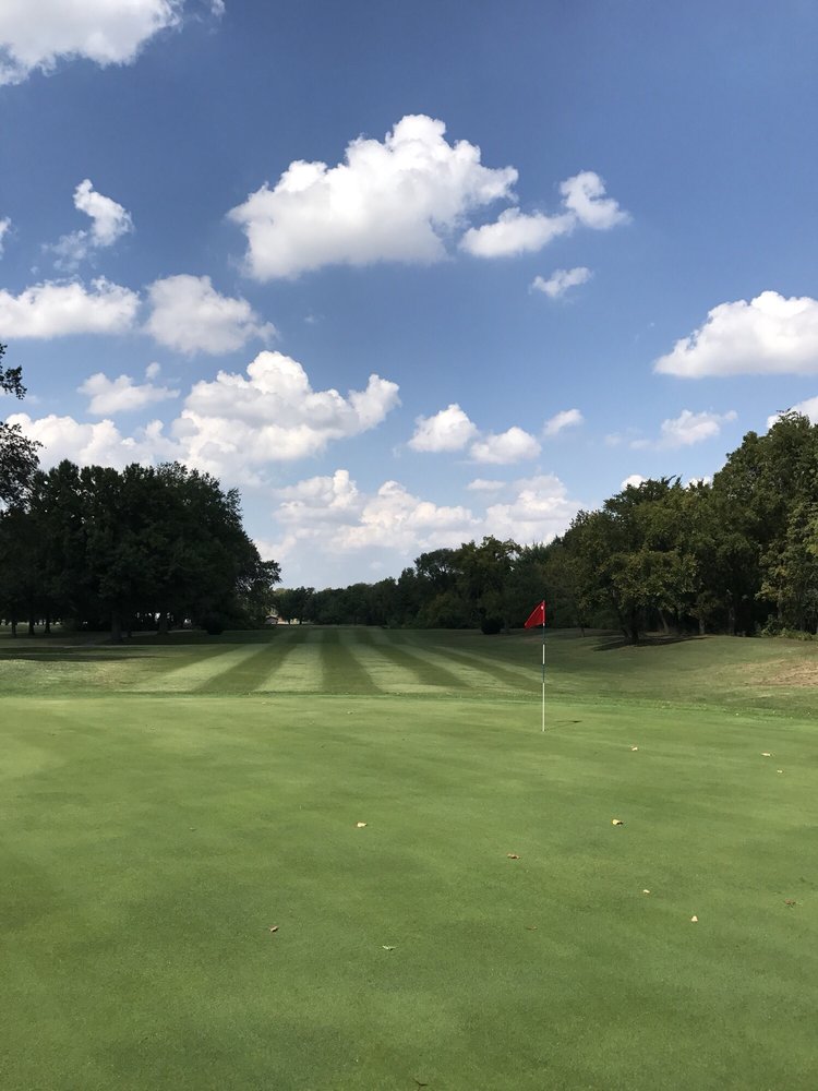 Golf course fairway with manicured greens